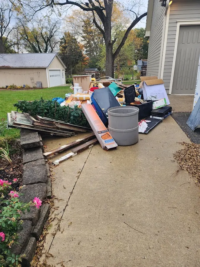 Dumpster being loaded with debris for 10 Yard Dumpster Rental in Wheatfield